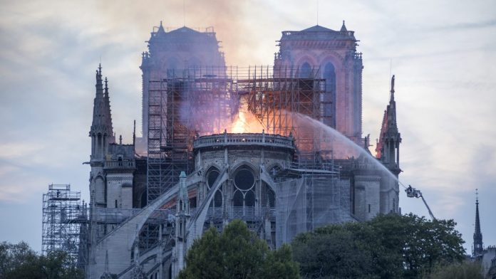 Major Blaze Devastates Notre-Dame Cathedral in Central Paris Flames and smoke rise from a fire at Notre-Dame Cathedral in Paris, France