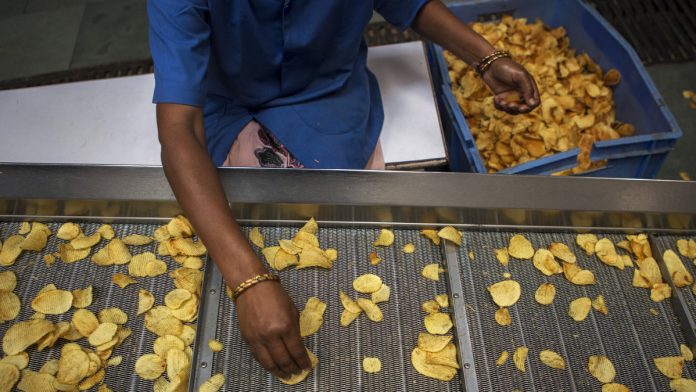 Potato Harvest And Operations Inside Potato Chip Maker Fryo Foods Pvt As Inflation Erodes Purchasing Power For Food Items Representational image | A worker sorts fried crinkle-cut potato chips at a factory in UP | Prashanth Vishwanathan | Bloomberg