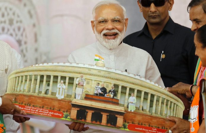 Lok Sabha polls: PM Modi in Amreli File photo of PM Narendra Modi being presented a memento during an election campaign, Gujarat | PTI