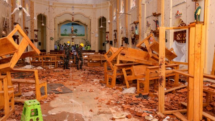 Latest news on Sri Lanka blasts | ThePrint.in Sri Lankan soldiers inspect the damage inside St. Sebastian's Church where a bomb blast took place in Negombo, Sri Lanka