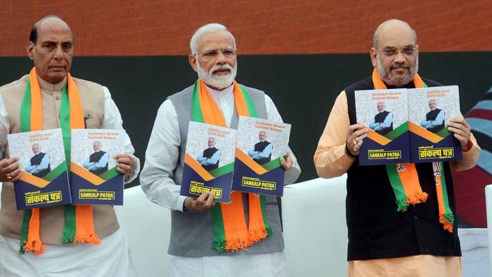 Latest news on BJP | ThePrint Rajnath Singh, PM Modi and Amit Shah launching the BJP manifesto | ANI