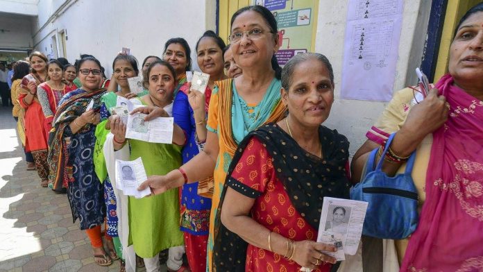 Lok Sabha polls: Phase 3 Women voters queue up to cast their votes at a polling station
