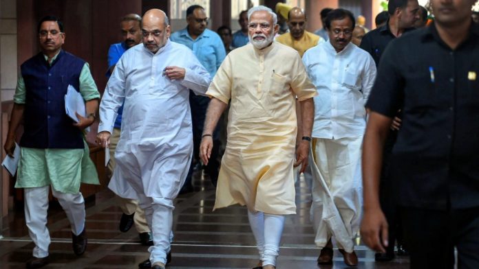 Prime Minister Narendra Modi, Union Home Minister and BJP President Amit Shah at Parliament library, New Delhi | File photo: PTI