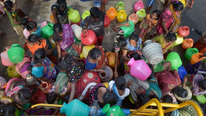 Weather: Water crisis in Chennai People rush to fill their vessels from a water tanker in Chennai | File photo: PTI