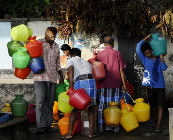 People struggle to collect water in Chennai. | ANI Photos