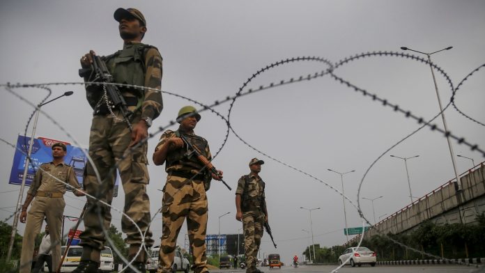 Restrictions in Jammu Paramilitary personnel stand guard during restrictions in Jammu