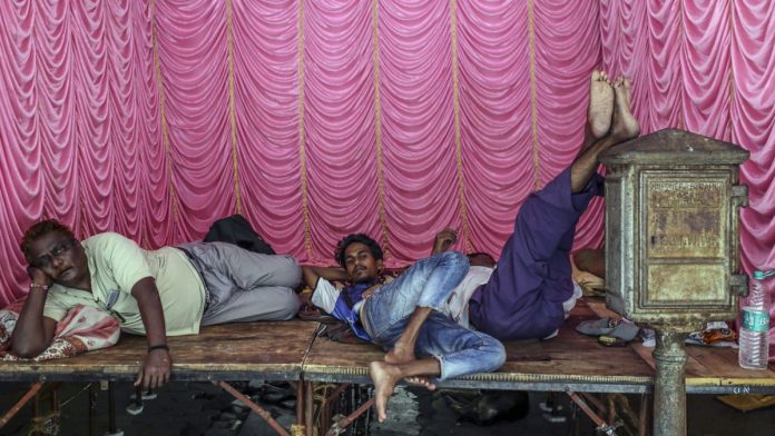 India May Have Entered Quasi-Recession as GDP Growth Plummets People take break at shed for upcoming festival in Mumbai, India, on Thursday, Aug. 29, 2019. | Photographer: Dhiraj Singh | Bloomberg