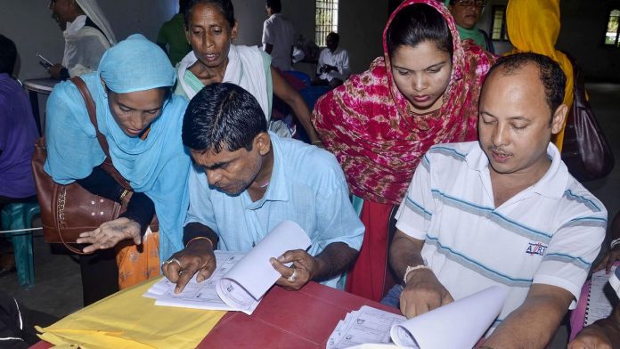 National Register of Citizens (NRC) final list People check their names on the NRC final list at a NRC centre in Buraburi Gaon, Morigaon.