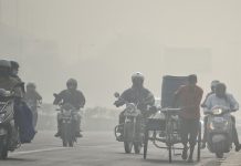 Commuters on two-wheelers plying through a thick layer of smog in New Delhi on 10 November | ANI Photo