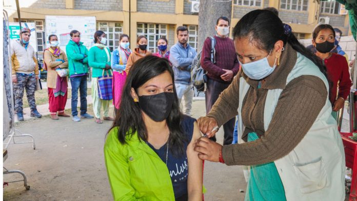 Web_Photo_Editor (62) A health worker inoculates a dose of Covid-19 vaccine to a beneficiary, in Kullu on 17 November 2021| PTI