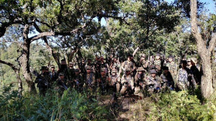 Militants The two organisations released a statement with a picture showing a group of about 30 cadres brandishing Kalashnikov rifles | ThePrint