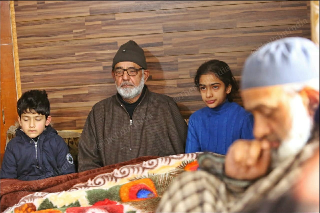 Mudassir Gul's father Ghulam Mohammad with his grandchildren Abir and Qurba Rafiya. | Photo: Praveen Jain/ThePrint